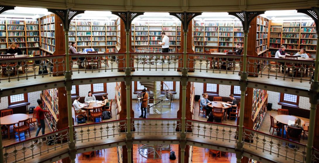 Linderman Library beauty shot students milling around in the stacks